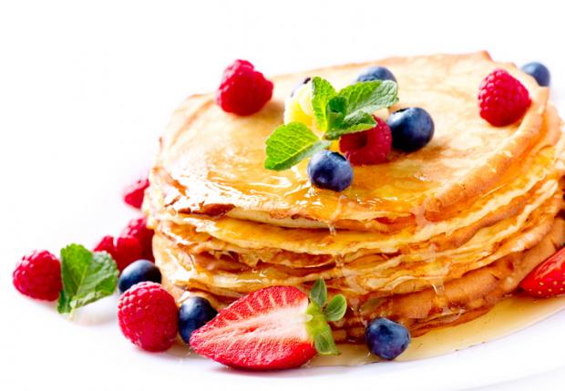 Pancake. Crepes With Berries. Pancakes stack isolated on White 