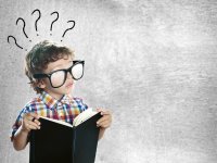 depositphotos/ bonninturina: мальчик с книгой задается вопросами