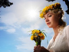 Andrejs Pidjass                     : Beautiful woman with dandelion flowers over blue sky